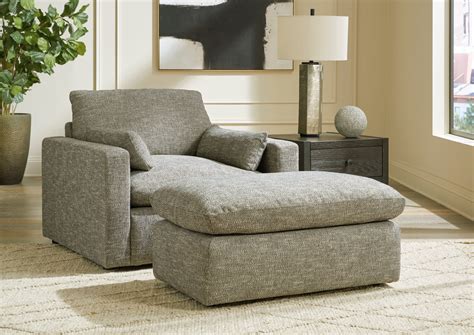 oversized chair with attached ottoman.